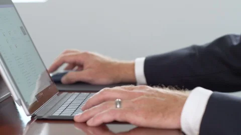 326. Business man a computer with wedding band close up of hands Stock-Footage 119733734