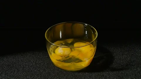 3291 Egg Shells Falling to in Bowl with Cracked Eggs in Slow Motion Stock Footage 48785172