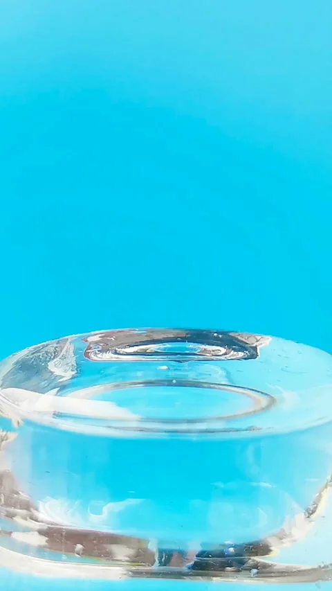 32x slow motion of a water drop falling to a water surface Stock Footage 124245934