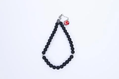 33 knots made of stone on a matte surface on a white background Stock Photos