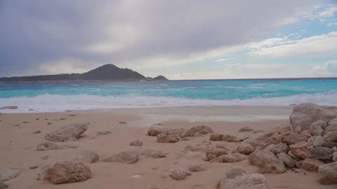 33 Sandy beach with rocks. Kaputash Beach in Turkey. Tourist destination Anta Stock Footage 169667668