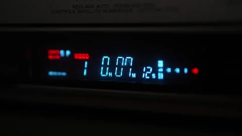 3/4 closeup shot on fast rewind vcr display and eject Video stock 335646748
