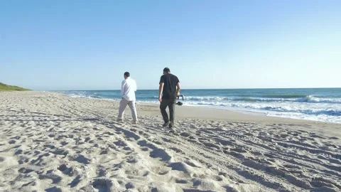 346 Behind the scenes of a video on the beach wide Stock Footage 138445251