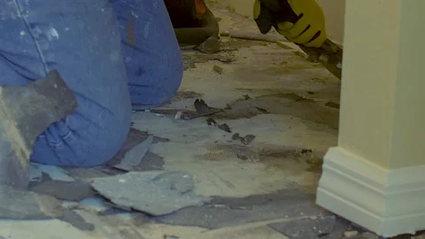 349 Construction worker breaking apart tile in a house Stock-Footage 132459668