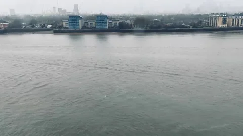 34s Rain and Wind on Thames River with Uber Boats Traveling By Timelapse Stock Footage 231044506