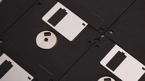 3.5 inch old computer floppy disks - vintage technology, closeup 動画素材 118260612