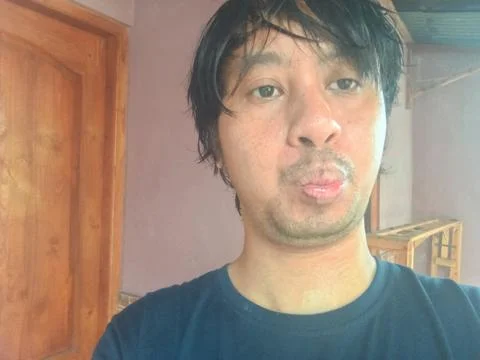 A 35-year-old man taking selfies using a variety of styles 스톡 사진