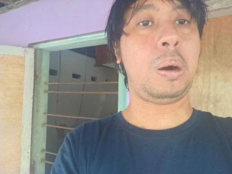 A 35-year-old man taking selfies using a variety of styles Fotos Stock