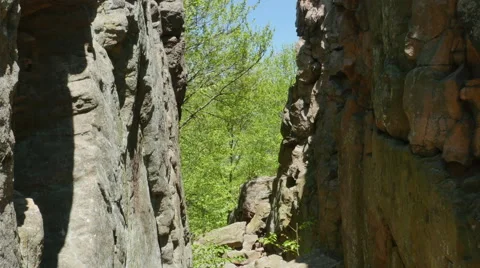 3562 Split Rock Cliff Blue Sky Forest, 4K Video stock 50152149