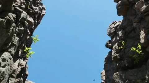 3563 Split Rock Cliff Blue Sky Bird Flying, 4K Video stock 50152199