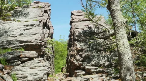 3566 Split Rock Cliff Blue Sky Forest, 4K Video stock 50153289