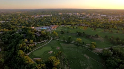 3.59 Manhattan Golf Course Panning Right to Reveal Sunset 002605 Stock Footage 90258543