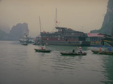 35MM 2K EXT DAY-HA LONG BAY VIETNAM- CAM MOVING W GROUP OF BOATS Stock Footage 75373271