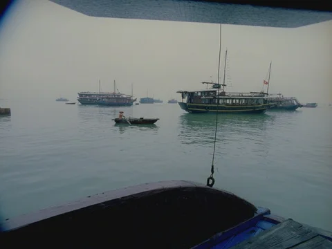 35MM 2K EXT DAY-HA LONG BAY VIETNAM- CAM MOVING W BOATS Stock Footage 75373414