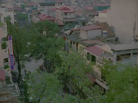 35MM 2K EXT DAY-HANOI, VIETNAM- HIGH ANGLE OF ROOFTOPS STREET AND TRAFFIC Stock Footage 75373799