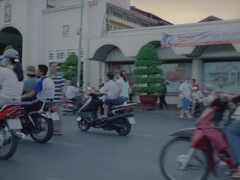 35MM 2K EXT DAY-SAIGON VIETNAM- CAM TRACKING WITH TRAFFIC ON STREET Stock Footage 75374819