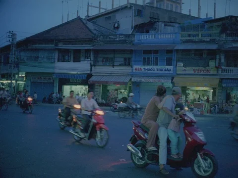 35MM 2K EXT DUSK-SAIGON STREET SHOPS TRAFFIC  Stock Footage 75375196