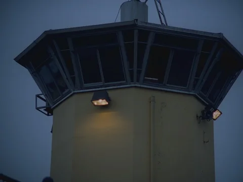 35MM 2K EXT. DUSK STATE PRISON- GUARD TOWER Stock Footage 75364038
