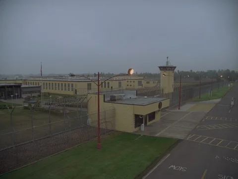 35MM 2K EXT. DUSK STATE PRISON- WIDE TOWER AND GROUNDS Stock Footage 75364265