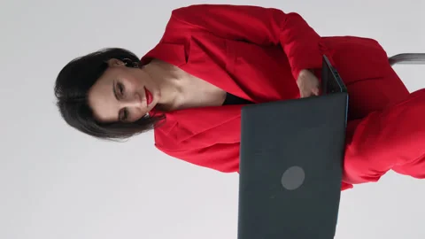 35s nice-looking attractive gorgeous woman using laptop computer. Vertical video Stock Footage 180395253
