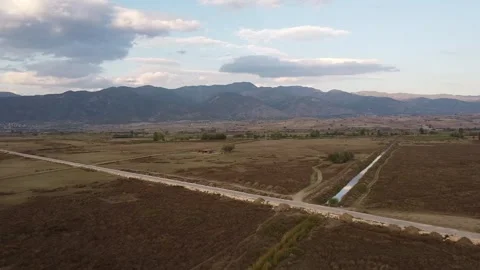 360° Aerial View of Fields, Mountains and Road – 4K Panoramic Drone Footage Stock Footage 319689405