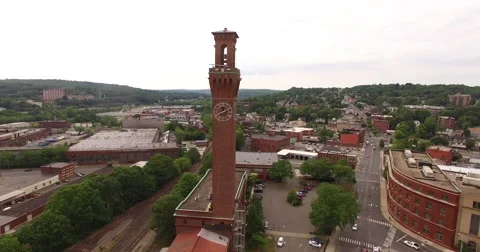 360 aerial view of a small town with a clock tower in 4K Stock Footage 64832996