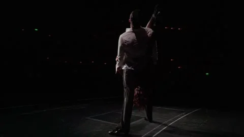 360-degree camera flyby around dance couple standing in inverted support,woman Stock-Footage 219234141