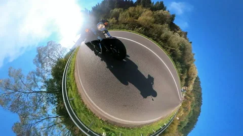 360 degree camera view of fast motorcyclist biker riding chopper motorbike Stock Footage 167922634