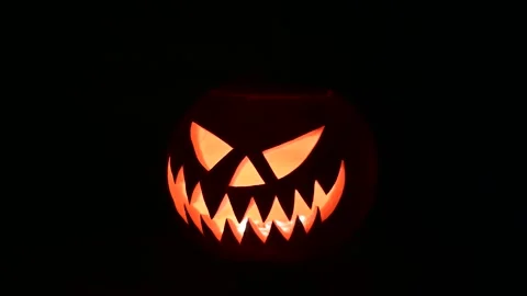 360 degree rotating glowing jack-o-lantern lit from inside Stock Footage 317312520