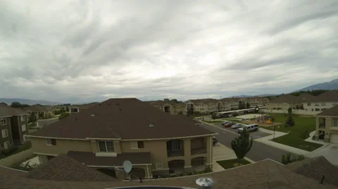 360 Degree Rotating Time Lapse Clouds Moving Overhead In Suburban Neighborhood Stock Footage 34694174