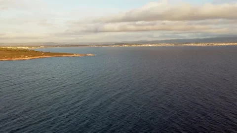 360 degree rotation in the bay of Alghero at sunset Stock Footage 138891608