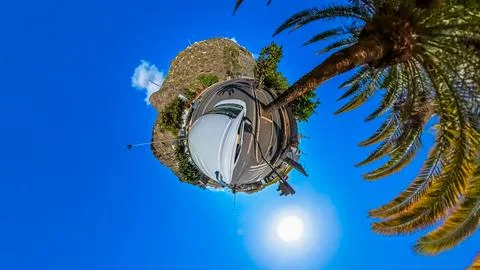 360 degree spherical photo "Tiny Planet" of a driving with trees and mountains 스톡 사진