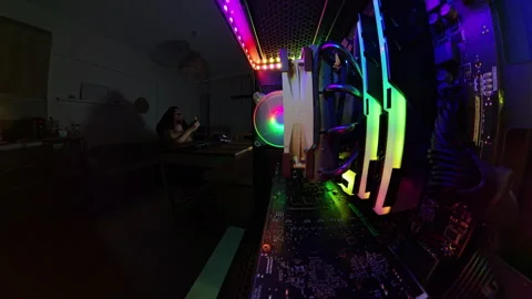 A 360-degree view from inside a gaming PC, showcasing a man with a bare torso Stock Footage 289782464