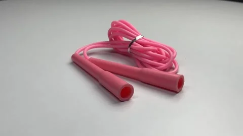 360 degree view of pink skipping rope for an exercise, isolated on white Stock Footage 276180429