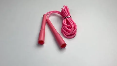 360 degree view of pink skipping rope for an exercise, isolated on white 動画素材 276200530