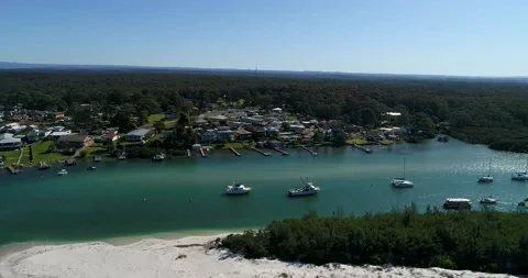 360 degrees aerial hover over Huskisson town waterfront on Jervis bay. Stock Footage 138291158