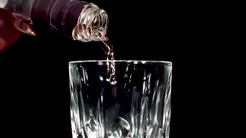 360 degrees epic shot in extreme slow motion from pouring whiskey into the glass Stock Footage 169888155
