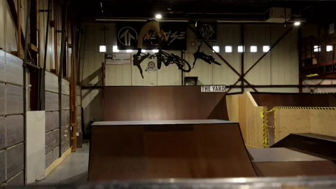 360 downside tailwhip on box jump BMX bike Stock Footage 157164417