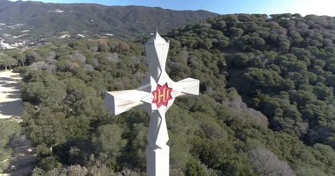 360 drone flight around a cross in the woods near the sea Stock Footage 88106500