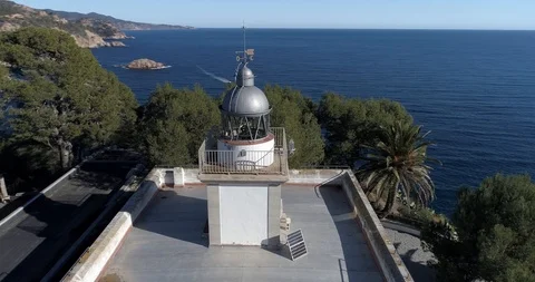 360 drone flight around a lighthouse on the coast of the Mediterranean Sea Stock Footage 85610452