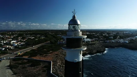 360 drone flight around a lighthouse on the island of Menorca Stock Footage 116388375