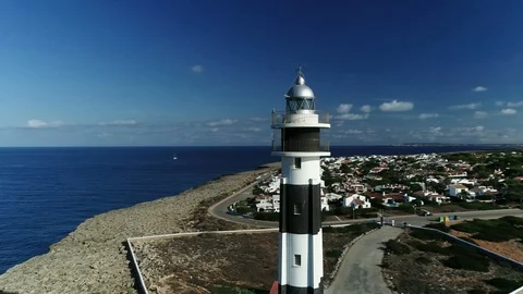 360 drone flight around a lighthouse on the island of Menorca Stock Footage 119288248