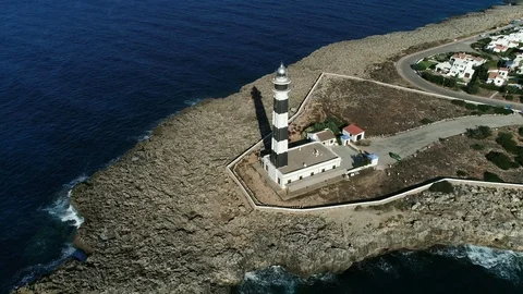 360 drone flight around a lighthouse on the island of Menorca Stock Footage 119288272