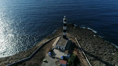 360 drone flight around a lighthouse on the island of Menorca Stock Footage 119288387