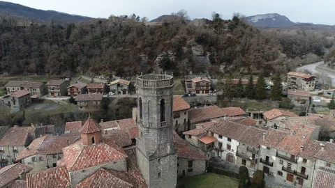 360 drone view around the bell tower of a small mountain town Stock Footage 102215469