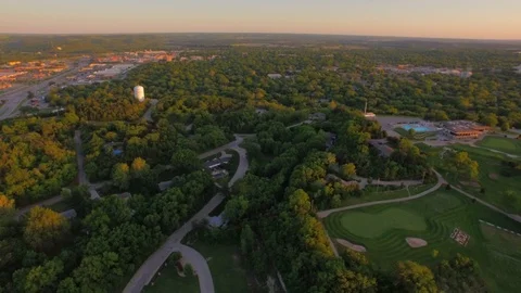 3.60 Manhattan Golf Course Slow 180 Pan to Reveal Sunset 004614 Stock Footage 90258599