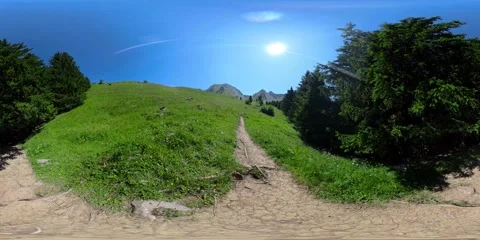 360° Panoramic View of Alpine Mountains from a Sloping Meadow Trail 스톡 동영상 317610904