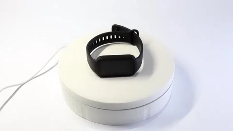 360° Rotation Video of Black Smart Band on White Background Stock Footage 300550399