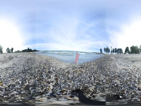 360 Virtual Reality - 4k clip of American flag on the beach Stock Footage 77309096