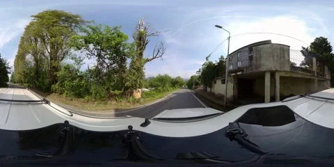 360 VR The car drives on the road along the forest Stock Footage 167657802